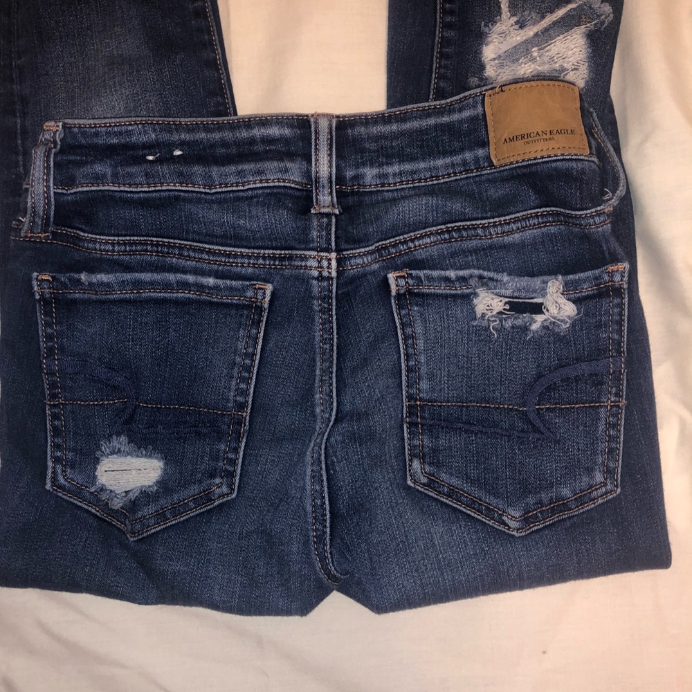 dark blue ripped jeans